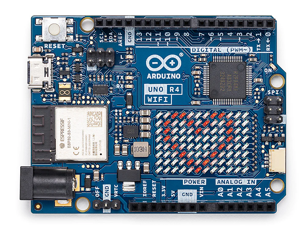 An Arduino UNO R4 WiFi board seen from directly above: a USB-C socket, a barrel jack, an Espressif radio module, a grid of small red LEDs, and rows of black header sockets down both long edges.